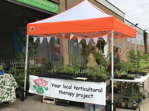 Growing People Stall at Fairhaven Wholefoods Ltd copyright Growing People 2023